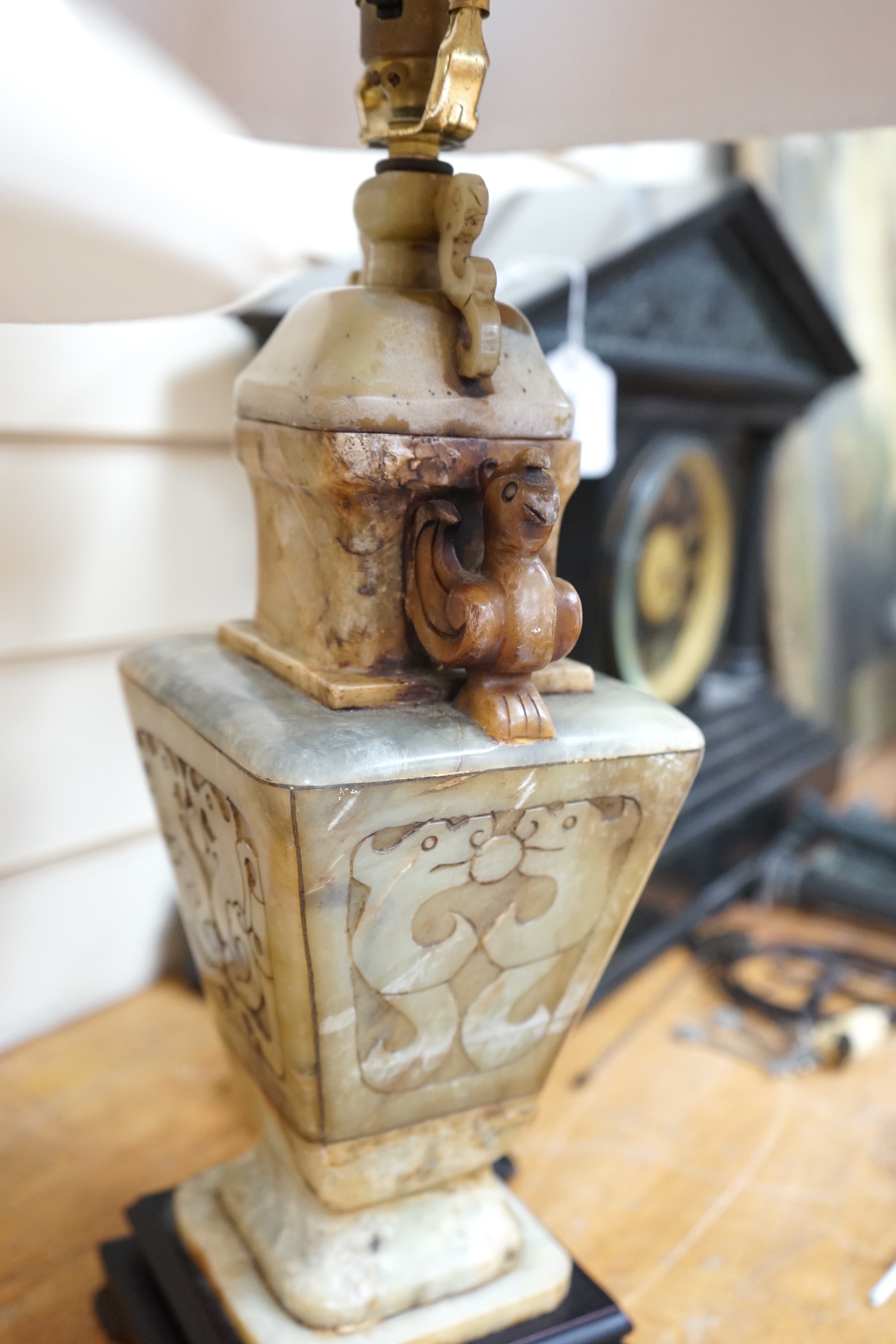 A Chinese style soapstone lamp and another porcelain dragon lamp, tallest 70cm high. Condition - fair